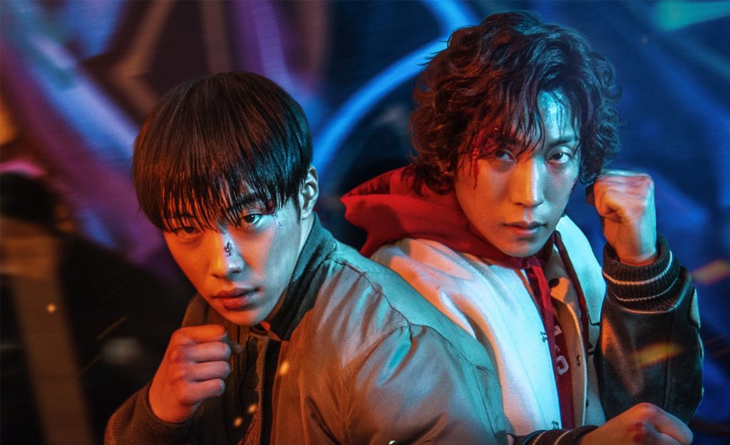 Woo Do-hwan (O Rei Eterno) e Lee Sang-yi (Hometown Cha-Cha-Cha) em Cães de Caça. (Imagem: Reprodução/Netflix)